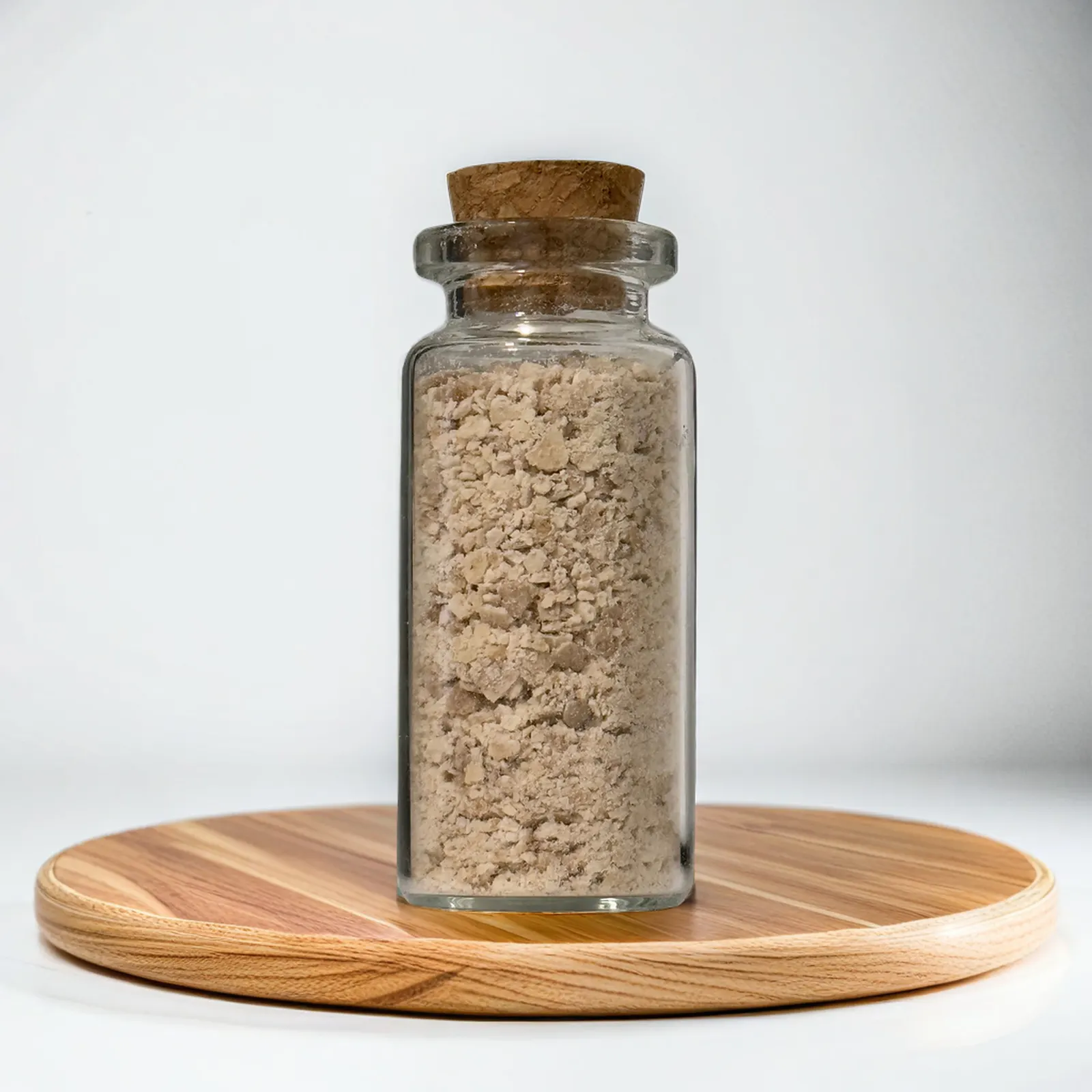 The sourdough starter jar on a wooden board
